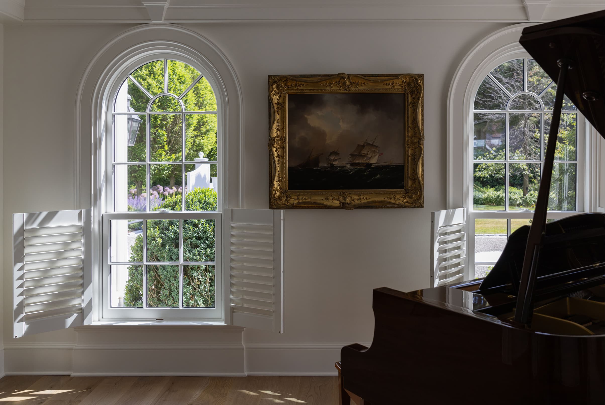 Living room with Marvin Ultimate Double Hung round top windows
