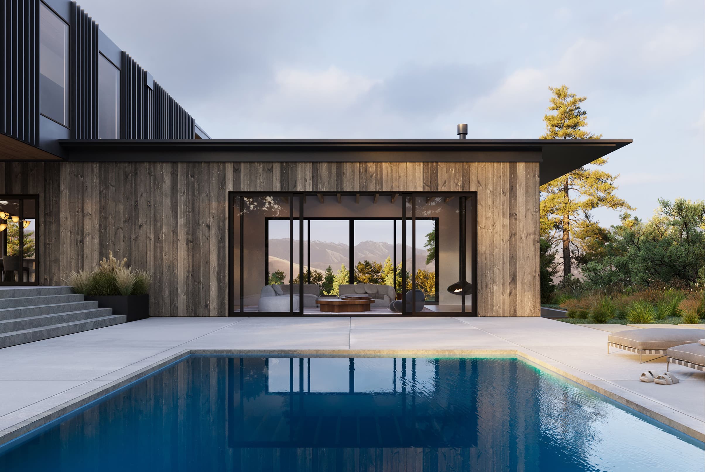 Exterior view of an opened black Marvin Modern Sliding door with a pool in the foreground.